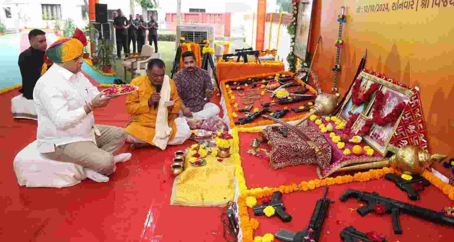 CM Patel Emphasises Duty During 'Shastra Pujan' Ceremony. CM Patel Emphasises Duty During 'Shastra Pujan' Ceremony.