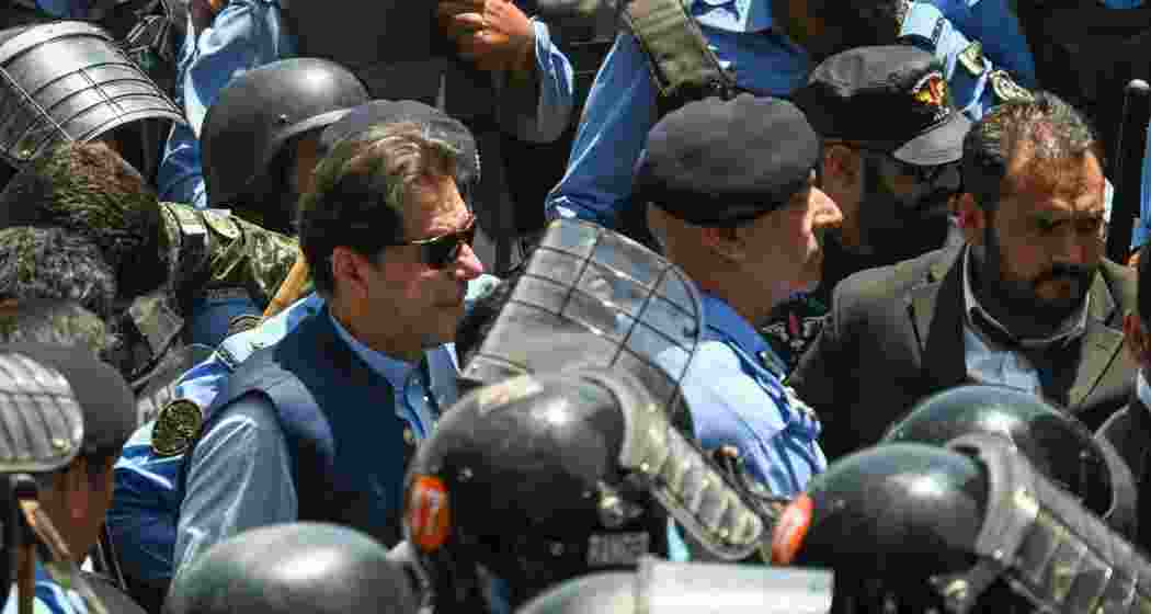 Police escort Pakistan's former Prime Minister Imran Khan upon his arrival at the high court in Islamabad. File photo. Police escort Pakistan's former Prime Minister Imran Khan upon his arrival at the high court in Islamabad. File photo.