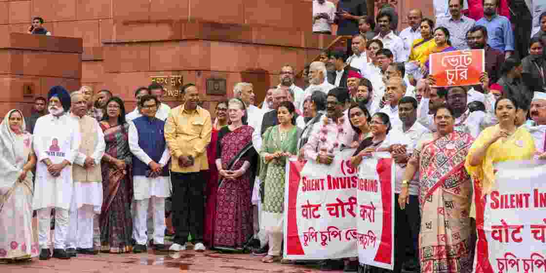 INDIA bloc members during a protest over the issues of alleged 'poll fraud' and SIR of electoral rolls. INDIA bloc members during a protest over the issues of alleged 'poll fraud' and SIR of electoral rolls.
