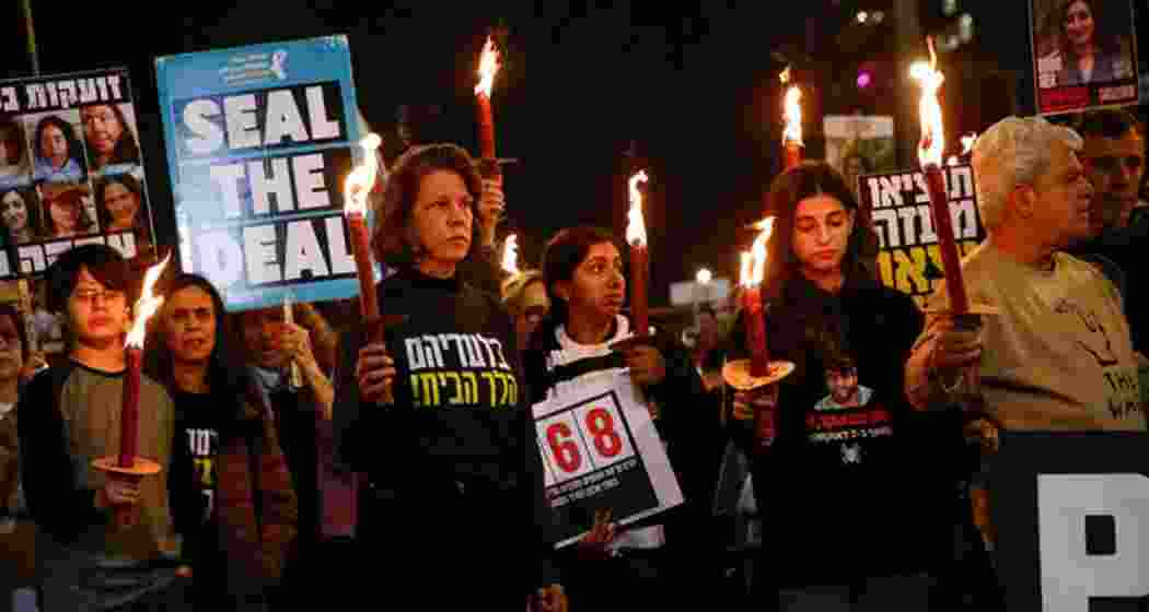 Family members and supporters of hostages taken during Hamas’s October 7, 2023, attack on Israel hold torchlights during a protest calling for a ceasefire, in Tel Aviv on January 16, 2025. Family members and supporters of hostages taken during Hamas’s October 7, 2023, attack on Israel hold torchlights during a protest calling for a ceasefire, in Tel Aviv on January 16, 2025.