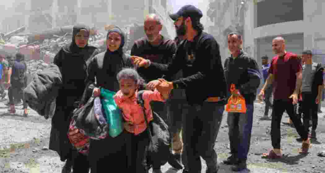 Palestinians evacuate in the aftermath of an Israeli strike on a house, in Gaza City, May 30, 2025 Palestinians evacuate in the aftermath of an Israeli strike on a house, in Gaza City, May 30, 2025