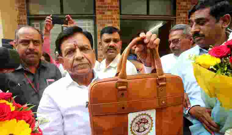 Madhya Pradesh Finance Minister Jagdish Devda presented the state budget for the year 2024-25 in the legislative assembly on Wednesday amid a ruckus created by the opposition Congress over an alleged nursing college scam. Madhya Pradesh Finance Minister Jagdish Devda presented the state budget for the year 2024-25 in the legislative assembly on Wednesday amid a ruckus created by the opposition Congress over an alleged nursing college scam.