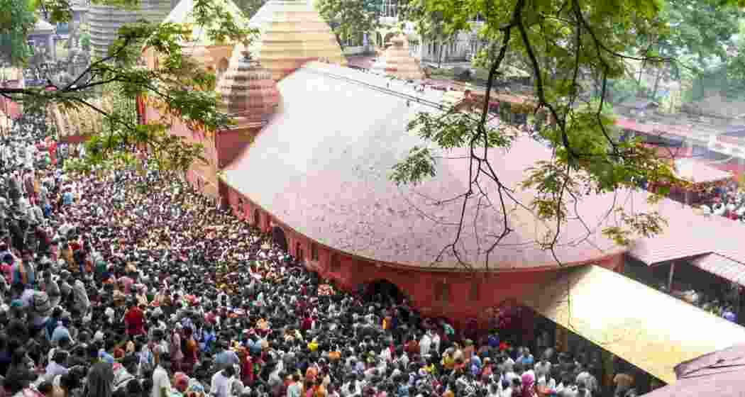 People throng the premises of Kamakhya Temple to offer prayers after the sacred doors of the temple re-opens, concluding the four-day annual Ambubachi Mela, in Guwahati, Assam, on Friday. People throng the premises of Kamakhya Temple to offer prayers after the sacred doors of the temple re-opens, concluding the four-day annual Ambubachi Mela, in Guwahati, Assam, on Friday.