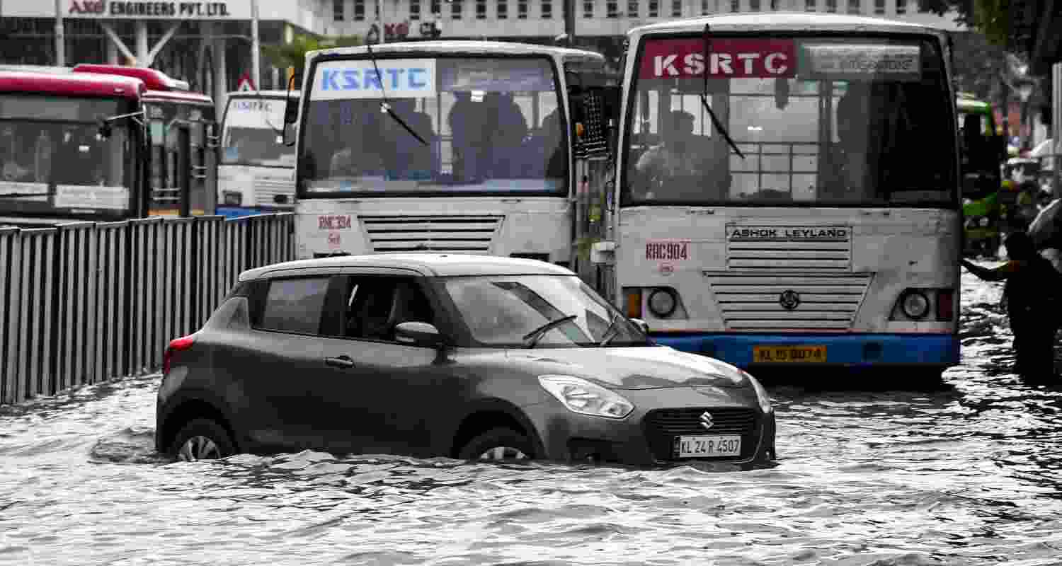 Vehicles wade through a waterlogged road after rainfall, in Thiruvananthapuram, Keralam, Saturday, May 30, 2026. Vehicles wade through a waterlogged road after rainfall, in Thiruvananthapuram, Keralam, Saturday, May 30, 2026.