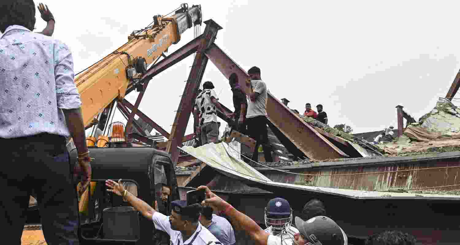 Officials gather after a three-storey under-construction warehouse collapsed in the Taratala area, in Kolkata, West Bengal, Wednesday, June 24, 2026. Officials gather after a three-storey under-construction warehouse collapsed in the Taratala area, in Kolkata, West Bengal, Wednesday, June 24, 2026.