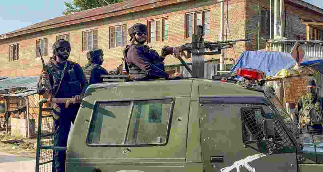 Security personnel keep a vigil amid an ongoing encounter between security forces and terrorists in a forest area at Akhal, in Kulgam district, Jammu and Kashmir, Sunday. Security personnel keep a vigil amid an ongoing encounter between security forces and terrorists in a forest area at Akhal, in Kulgam district, Jammu and Kashmir, Sunday.