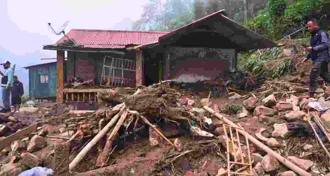 A mudslide triggered by heavy rains destroys a house near Mirik in the Darjeeling hills. A mudslide triggered by heavy rains destroys a house near Mirik in the Darjeeling hills.