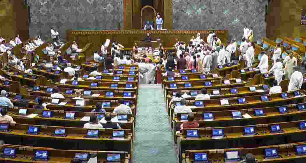 Opposition MPs protest in the Lok Sabha during the Monsoon session of Parliament. Opposition MPs protest in the Lok Sabha during the Monsoon session of Parliament.