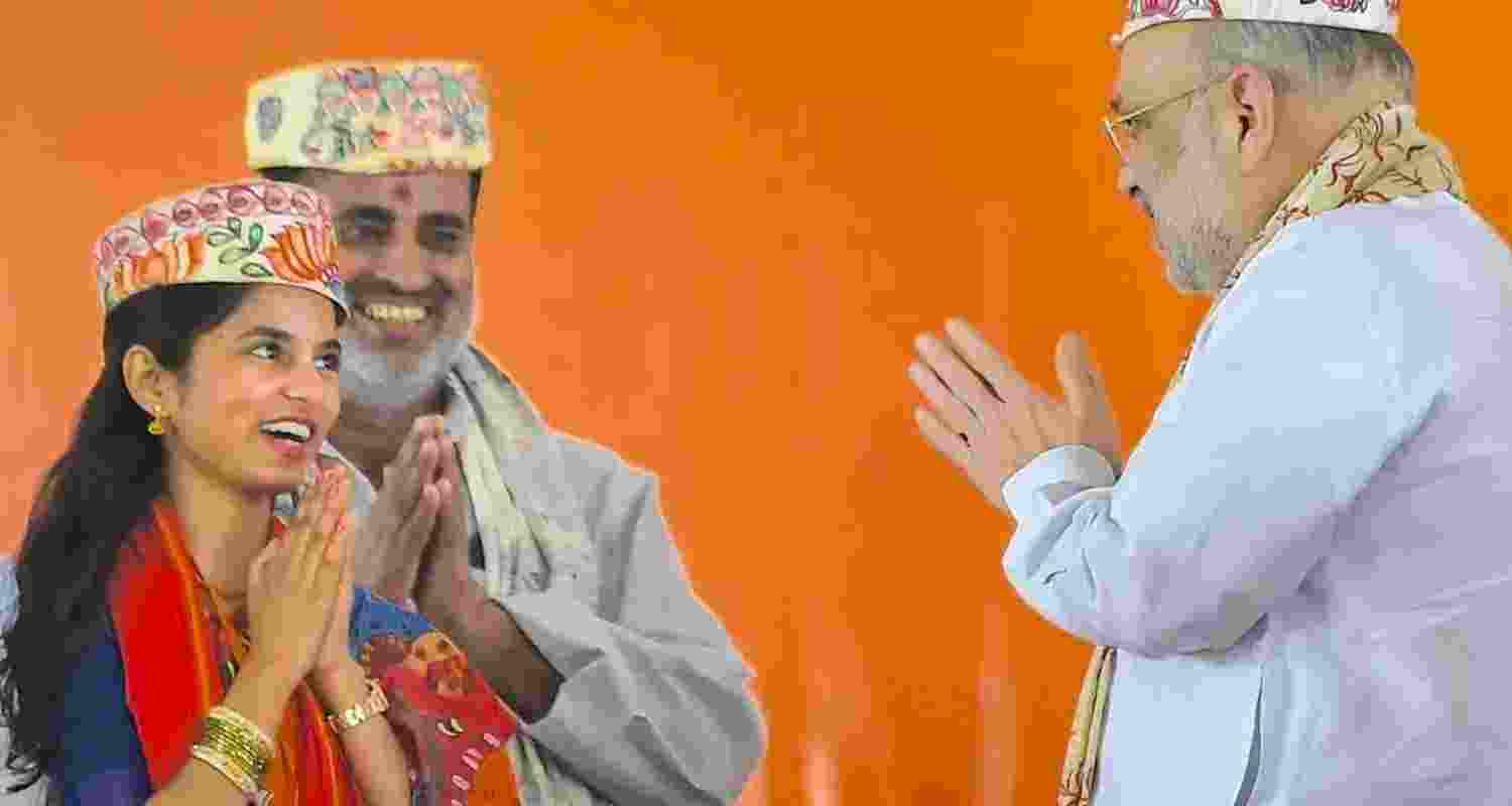 Maithili Thakur with Union Home Minister Amit Shah. Maithili Thakur with Union Home Minister Amit Shah.