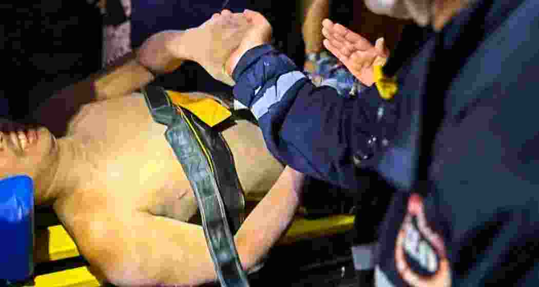 Rescue workers carry an injured man to hospital for treatment in Naypyitaw, Myanmar, on Wednesday, after he was pulled from the rubble of a collapsed hotel—five days after a devastating 7.7 magnitude earthquake struck the country. Rescue workers carry an injured man to hospital for treatment in Naypyitaw, Myanmar, on Wednesday, after he was pulled from the rubble of a collapsed hotel—five days after a devastating 7.7 magnitude earthquake struck the country.