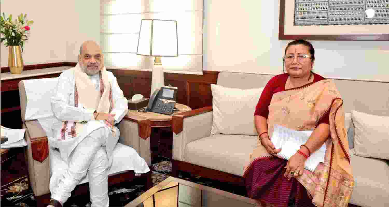 BJP's Manipur president A Sharda Devi (R) with Union Home Minister Amit Shah (L) in New Delhi on Thursday. BJP's Manipur president A Sharda Devi (R) with Union Home Minister Amit Shah (L) in New Delhi on Thursday.