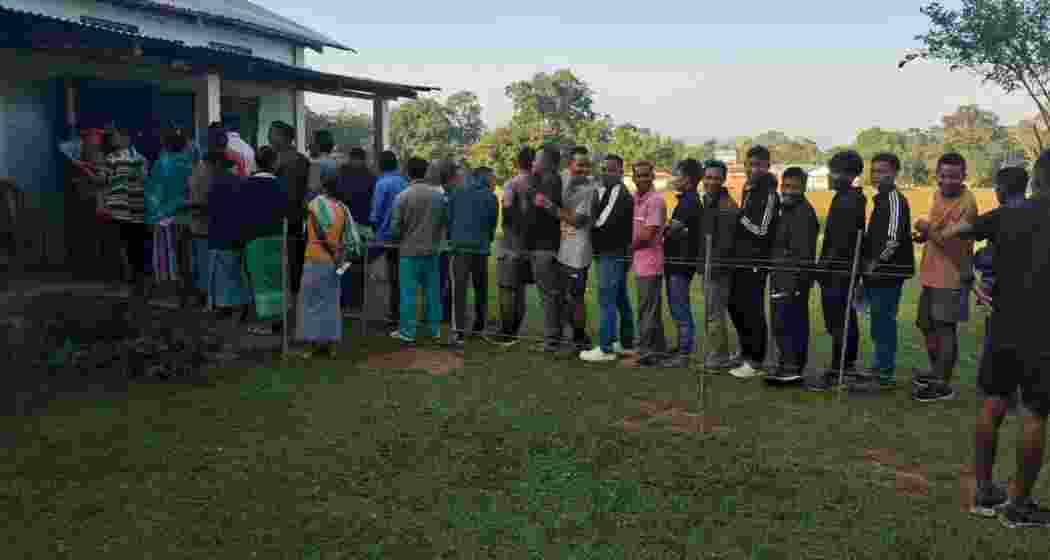 Voters patiently wait in line to cast their ballots in the by-election for the 56-Gambegre (ST) Assembly Constituency, marking an early surge in turnout. Voters patiently wait in line to cast their ballots in the by-election for the 56-Gambegre (ST) Assembly Constituency, marking an early surge in turnout.