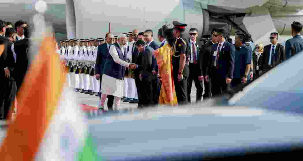 Prime Minister Narendra Modi with his Malaysian counterpart Anwar Ibrahim as the former is welcomed upon arrival at the airport, in Kuala Lumpur, Malaysia on Saturday. (Image: PMO via PTI Photo) Prime Minister Narendra Modi with his Malaysian counterpart Anwar Ibrahim as the former is welcomed upon arrival at the airport, in Kuala Lumpur, Malaysia on Saturday. (Image: PMO via PTI Photo)