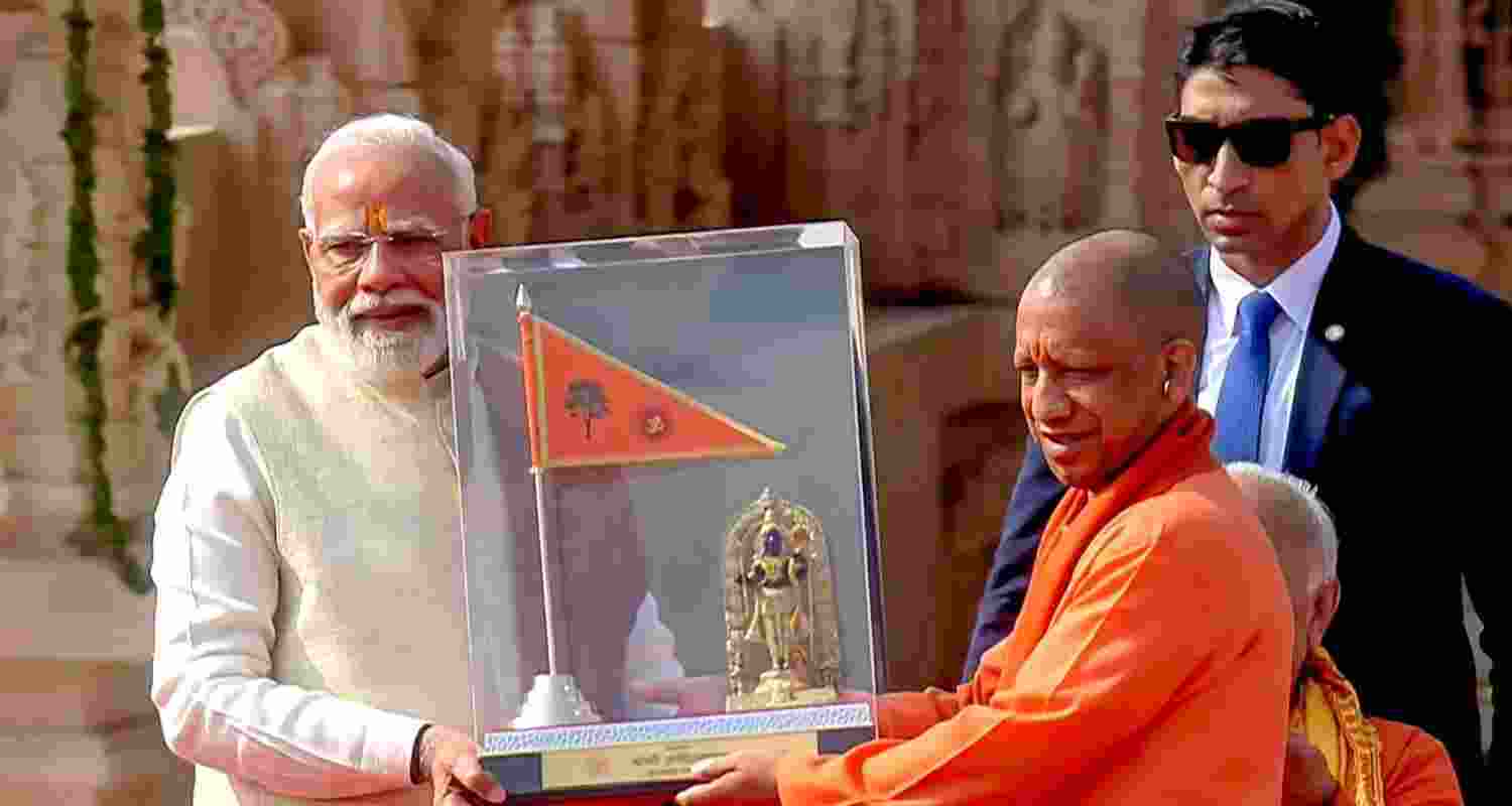 Prime Minister Narendra Modi with Uttar Pradesh Chief Minister Yogi Adityanath during the 'Dhwajarohan' ceremony at the Ram Temple, in Ayodhya, Uttar Pradesh. Prime Minister Narendra Modi with Uttar Pradesh Chief Minister Yogi Adityanath during the 'Dhwajarohan' ceremony at the Ram Temple, in Ayodhya, Uttar Pradesh.
