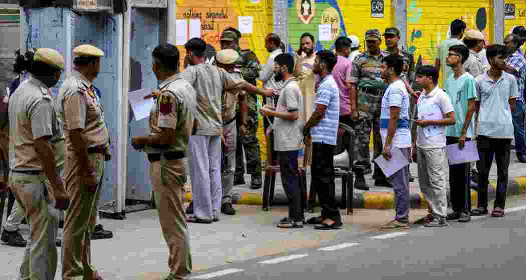 NEET-UG candidates undergo security screening before entering an examination centre, in New Delhi, Sunday, June 21, 2026. The Re-NEET UG 2026 examination is being conducted following the cancellation of the original test held on May 3 amid a paper leak controversy. NEET-UG candidates undergo security screening before entering an examination centre, in New Delhi, Sunday, June 21, 2026. The Re-NEET UG 2026 examination is being conducted following the cancellation of the original test held on May 3 amid a paper leak controversy.