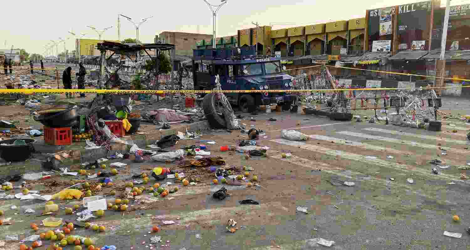 Police officers are seen at the scene of a bomb blast at a market in Maiduguri, Nigeria, Tuesday, March 17, 2026. Police officers are seen at the scene of a bomb blast at a market in Maiduguri, Nigeria, Tuesday, March 17, 2026.