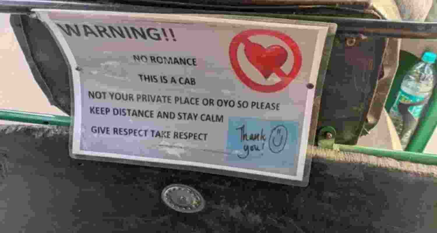 A photo, clicked by a passenger while sitting in the back of an auto, captured the warning issued by the driver. A photo, clicked by a passenger while sitting in the back of an auto, captured the warning issued by the driver.