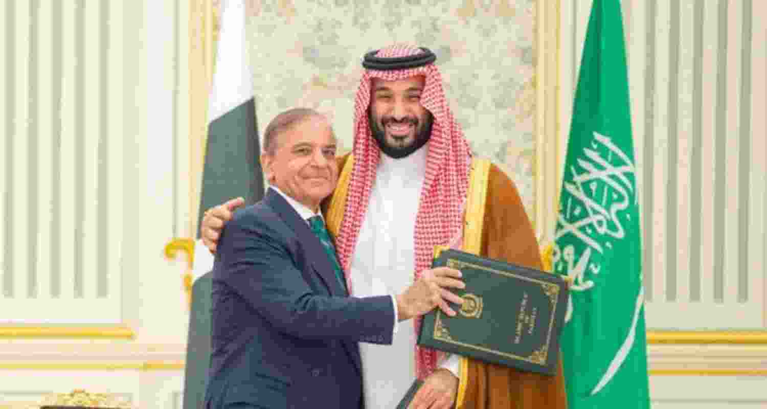 Pakistan PM Shehbaz Sharif and Saudi Crown Prince Mohammed bin Salman embrace after signing the agreement on September 17. Pakistan PM Shehbaz Sharif and Saudi Crown Prince Mohammed bin Salman embrace after signing the agreement on September 17.