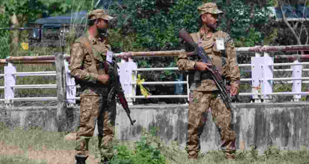 A file photo of Pakistan Army soldiers standing guard in the Red Zone area in Islamabad. A file photo of Pakistan Army soldiers standing guard in the Red Zone area in Islamabad.