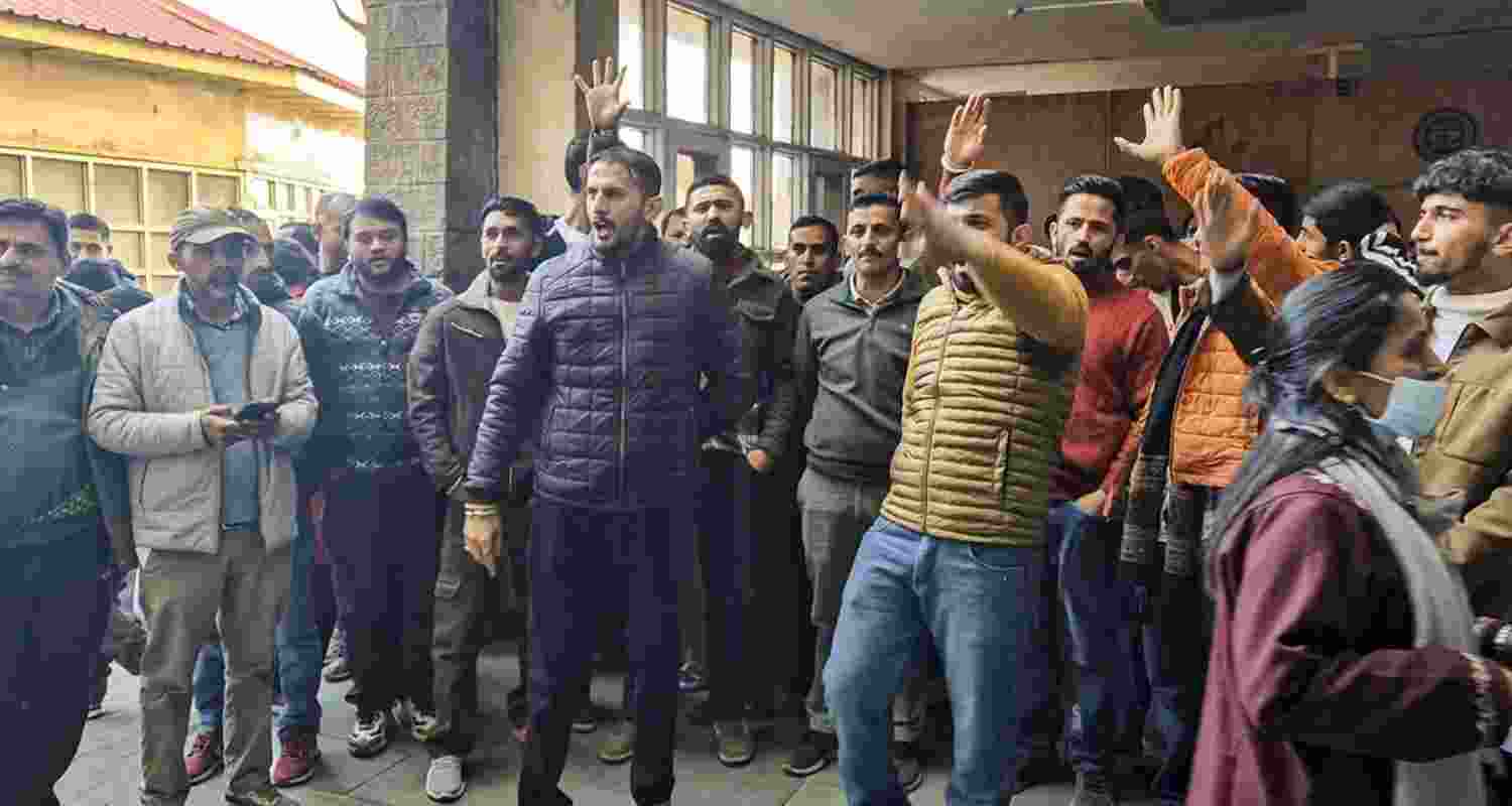 People protest after a video of a doctor allegedly assaulting a patient, who was lying on a hospital bed, at Indira Gandhi Medical College, went viral, outside the hospital in Shimla on Monday. People protest after a video of a doctor allegedly assaulting a patient, who was lying on a hospital bed, at Indira Gandhi Medical College, went viral, outside the hospital in Shimla on Monday.