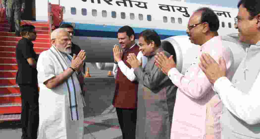 PM Narendra Modi is welcomed by Maharashtra CM Devendra Fadnavis and Union Minister Nitin Gadkari upon his arrival at Nagpur airport, ahead of his visit to key sites and project inaugurations. PM Narendra Modi is welcomed by Maharashtra CM Devendra Fadnavis and Union Minister Nitin Gadkari upon his arrival at Nagpur airport, ahead of his visit to key sites and project inaugurations.