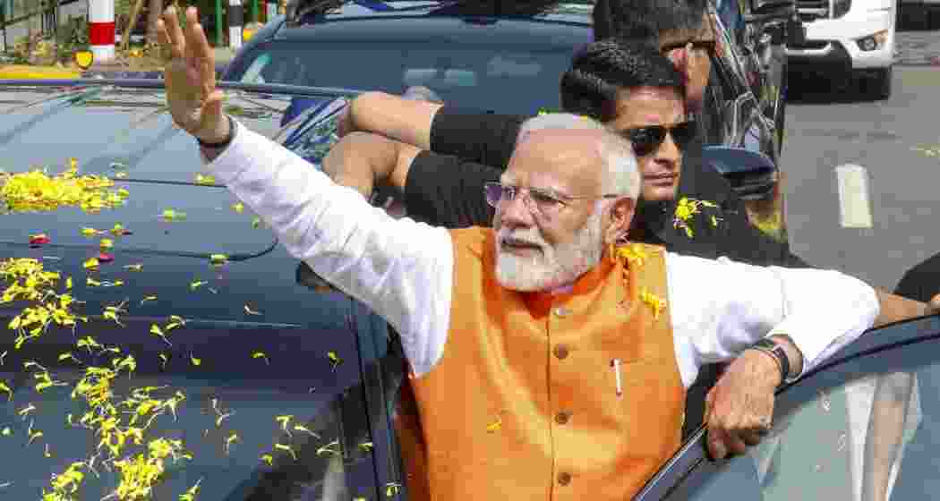 In this image made available from PMO, Prime Minister Narendra Modi waves at supporters during a roadshow in Vadodara, Gujarat, Monday, 26 May, 2025. In this image made available from PMO, Prime Minister Narendra Modi waves at supporters during a roadshow in Vadodara, Gujarat, Monday, 26 May, 2025.