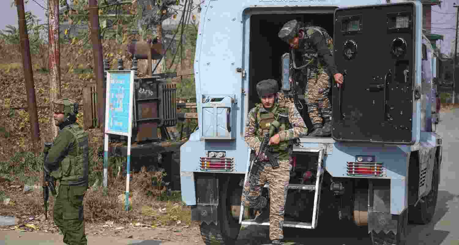 Police personnel cordon off an area while conducting a raid at a residential property at Karimabad village, in Pulwama district on Thursday. Police personnel cordon off an area while conducting a raid at a residential property at Karimabad village, in Pulwama district on Thursday.