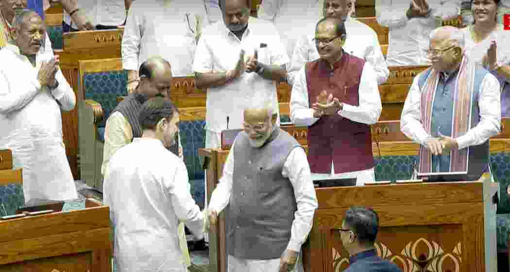 Prime Minister Narendra Modi and Leader of the Opposition Rahul Gandhi escort Om Birla to the chair after the latter was elected as the Speaker of the House during the first session of the 18th Lok Sabha, in New Delhi, Wednesday, June 26, 2024. Prime Minister Narendra Modi and Leader of the Opposition Rahul Gandhi escort Om Birla to the chair after the latter was elected as the Speaker of the House during the first session of the 18th Lok Sabha, in New Delhi, Wednesday, June 26, 2024.