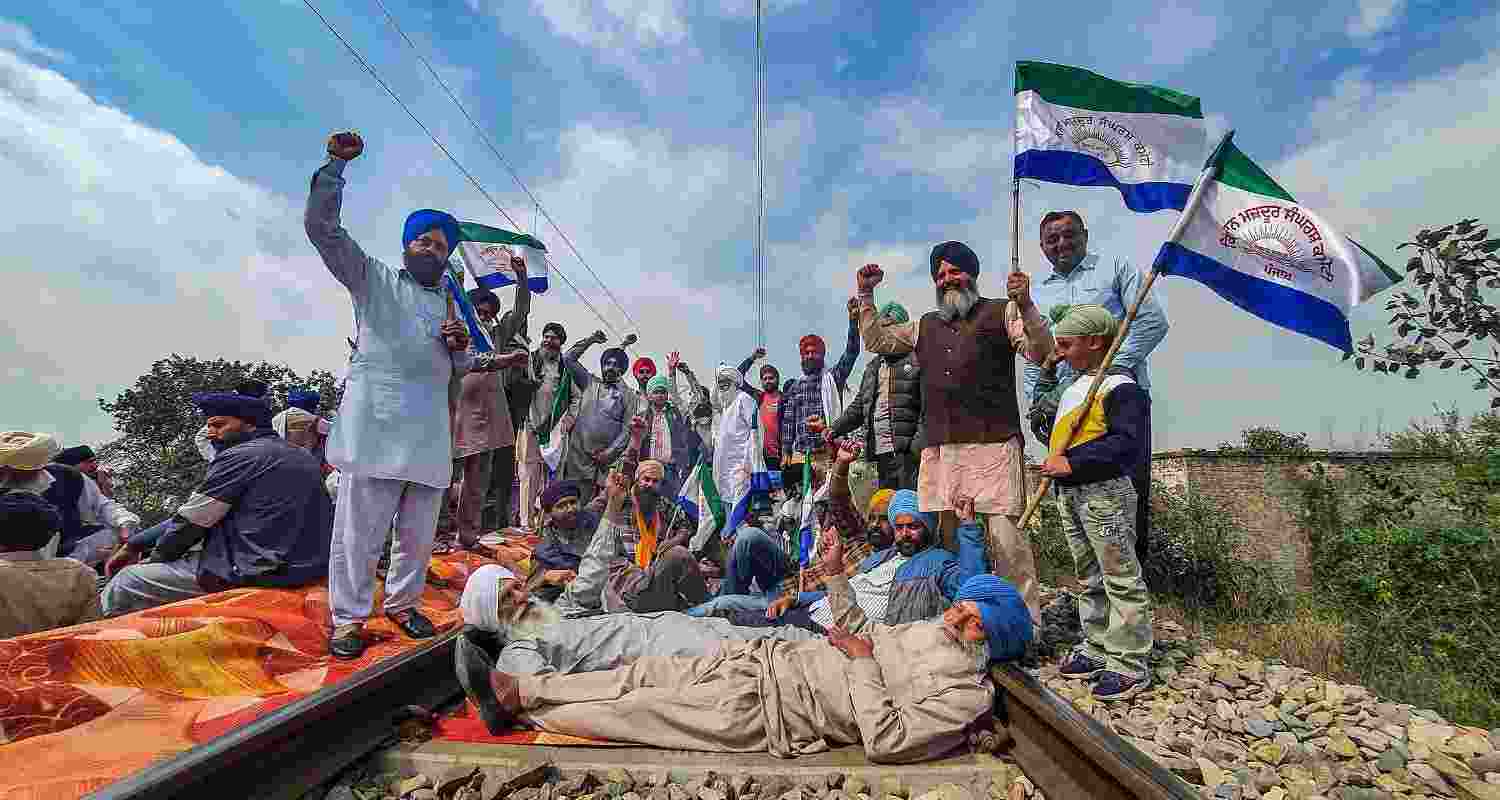An image of farmers protesting on a railway track, An image of farmers protesting on a railway track,