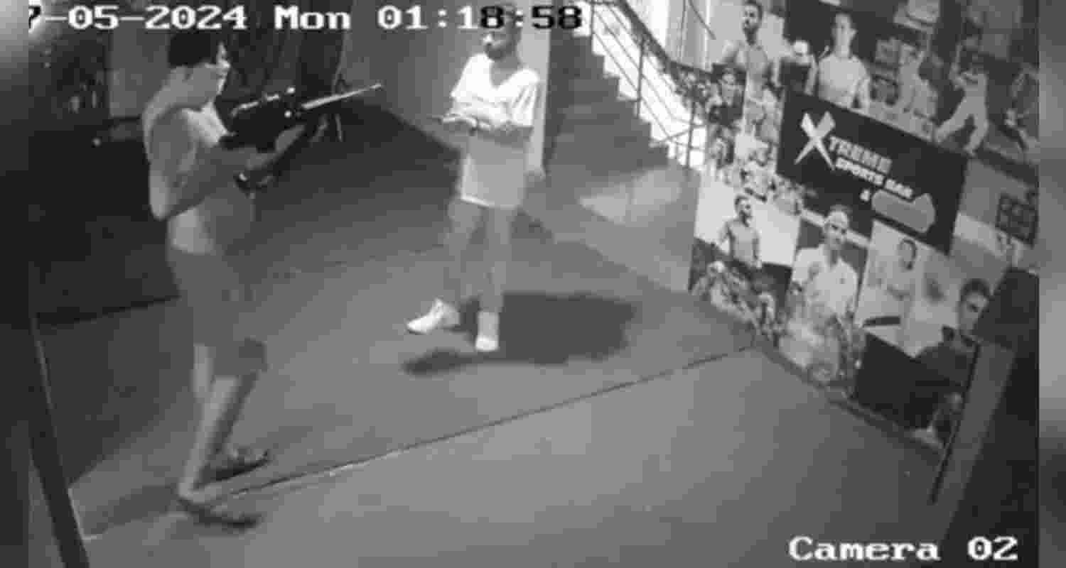 CCTV footage captured a bare-bodied man, his face concealed with a T-shirt, approaching the DJ at 1:18 am on Monday, brandishing a rifle. CCTV footage captured a bare-bodied man, his face concealed with a T-shirt, approaching the DJ at 1:18 am on Monday, brandishing a rifle.
