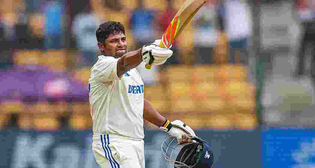 India's Sarfaraz Khan celebrates his century during the fourth day of the first test cricket match between India and New Zealand at M Chinnaswamy Stadium, in Bengaluru, Saturday, Oct 19, 2024. India's Sarfaraz Khan celebrates his century during the fourth day of the first test cricket match between India and New Zealand at M Chinnaswamy Stadium, in Bengaluru, Saturday, Oct 19, 2024.