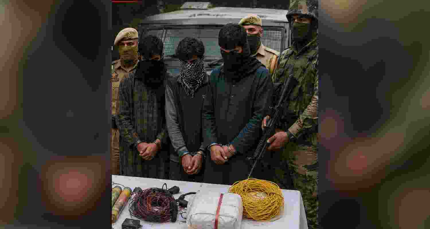 Three men were arrested in Shopian after police recovered grenades, plastic explosives, mobile phones and Hizbul Mujahideen posters. Three men were arrested in Shopian after police recovered grenades, plastic explosives, mobile phones and Hizbul Mujahideen posters.