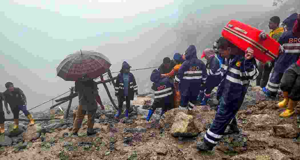 BRO personnel rescue stranded tourists after landslides, in North Sikkim. BRO personnel rescue stranded tourists after landslides, in North Sikkim.
