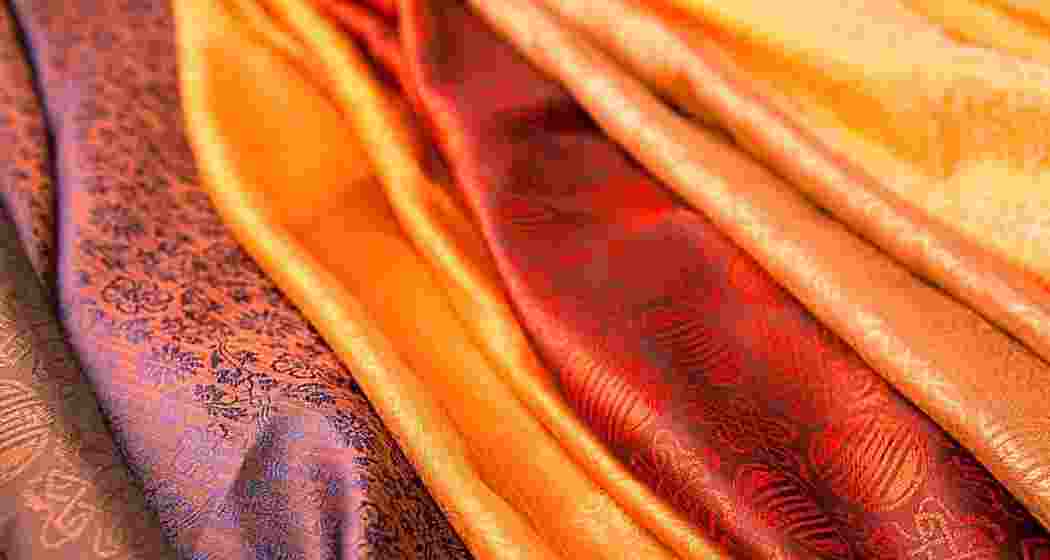 Muga silk sarees woven from Assam’s famed golden silk are displayed. Muga silk sarees woven from Assam’s famed golden silk are displayed.
