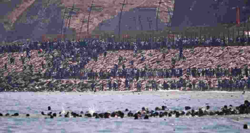 Migrants attempt to reach Spain's Ceuta enclave by swimming from Morocco. Migrants attempt to reach Spain's Ceuta enclave by swimming from Morocco.