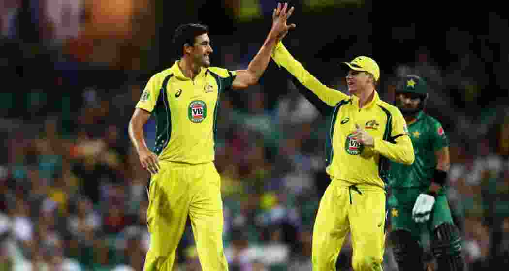 Mitchell Starc and Steve Smith celebrate a wicket during a match against Pakistan. Mitchell Starc and Steve Smith celebrate a wicket during a match against Pakistan.