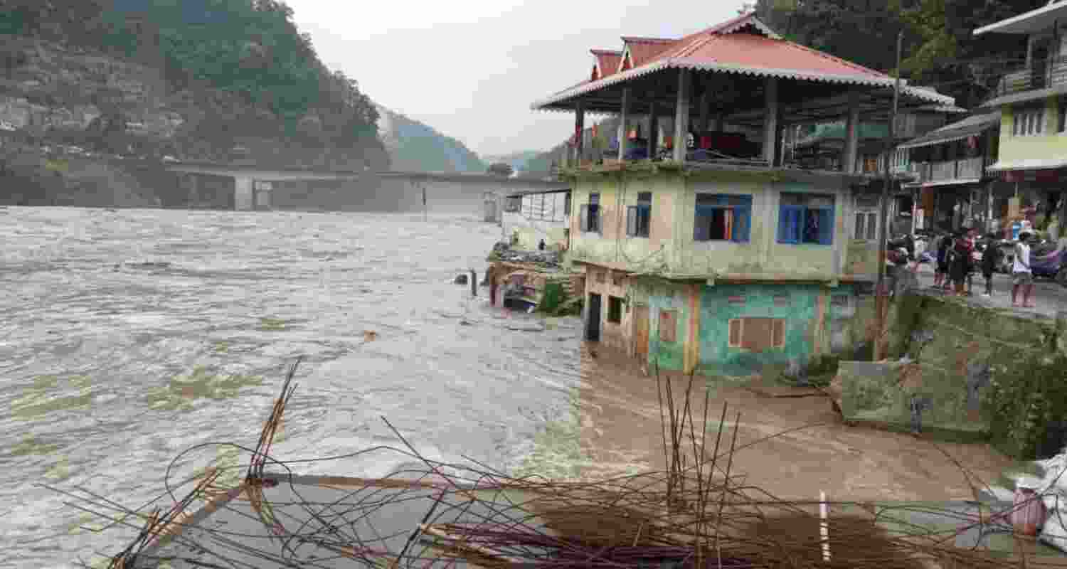 Partially submerged buildings due to overflowing of Teesta river following incessant rains, near Teesta Bazar area in Sikkim on June 20, 2024. Partially submerged buildings due to overflowing of Teesta river following incessant rains, near Teesta Bazar area in Sikkim on June 20, 2024.