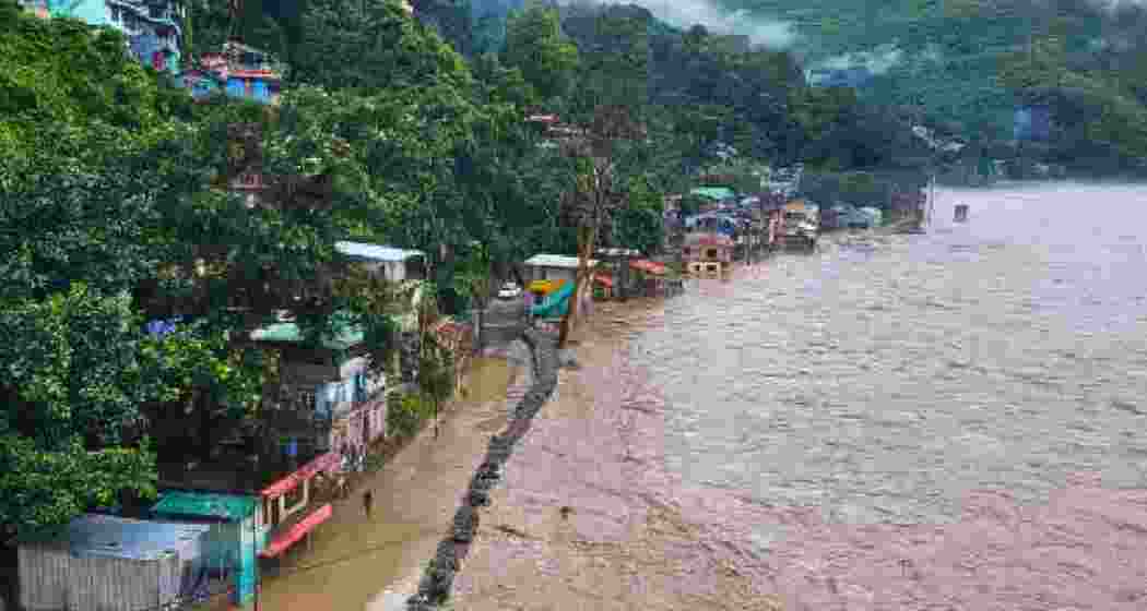 The Teesta River could be seen flooding localities near Teesta Bazar on Tuesday, disrupting movement along NH10 and submerging several low-lying homes across Kalimpong and Jalpaiguri districts. The Teesta River could be seen flooding localities near Teesta Bazar on Tuesday, disrupting movement along NH10 and submerging several low-lying homes across Kalimpong and Jalpaiguri districts.
