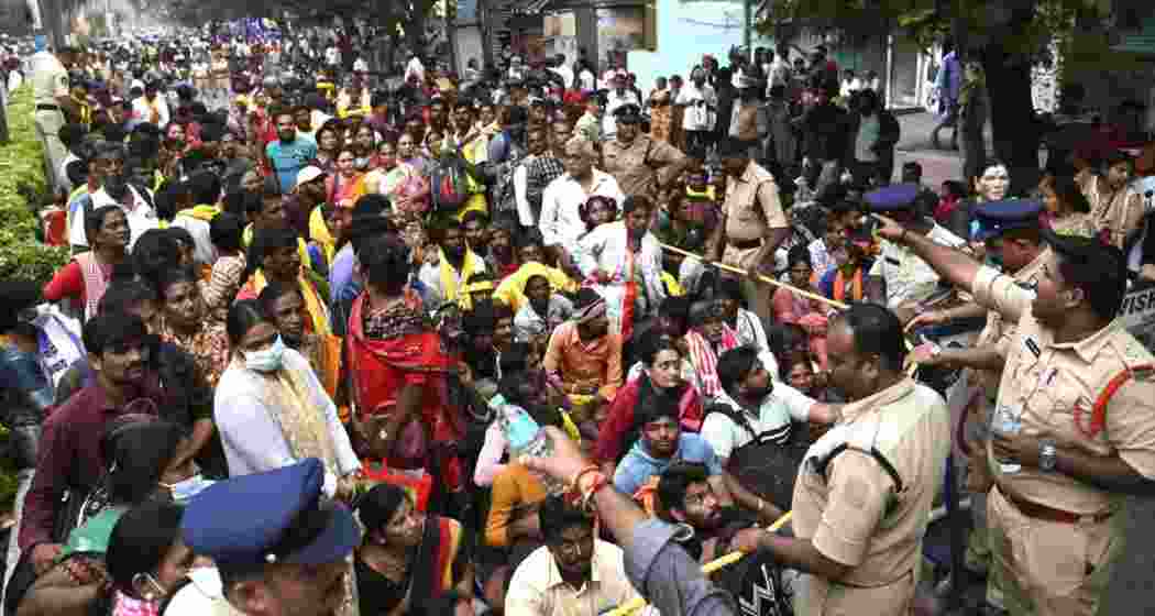 Police manage the crowd at Tirupati's temple after a stampede left six dead. Police manage the crowd at Tirupati's temple after a stampede left six dead.
