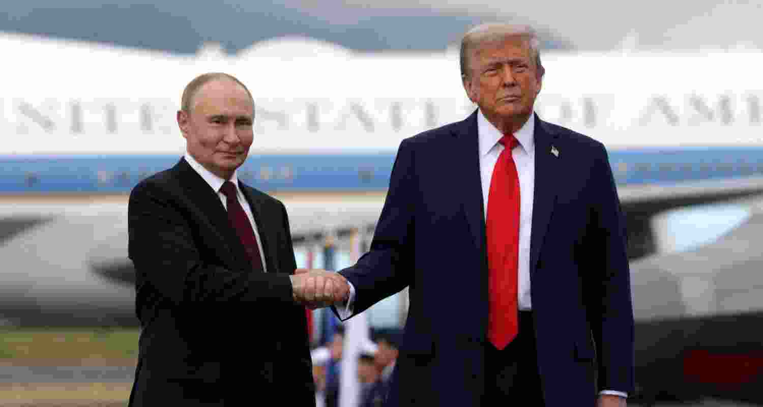 In this pool photograph distributed by the Russian state agency Sputnik, US President Donald Trump and Russian President Vladimir Putin shake hands after their arrival for a US-Russia summit on Ukraine at Joint Base Elmendorf-Richardson in Anchorage, Alaska, on August 15. In this pool photograph distributed by the Russian state agency Sputnik, US President Donald Trump and Russian President Vladimir Putin shake hands after their arrival for a US-Russia summit on Ukraine at Joint Base Elmendorf-Richardson in Anchorage, Alaska, on August 15.