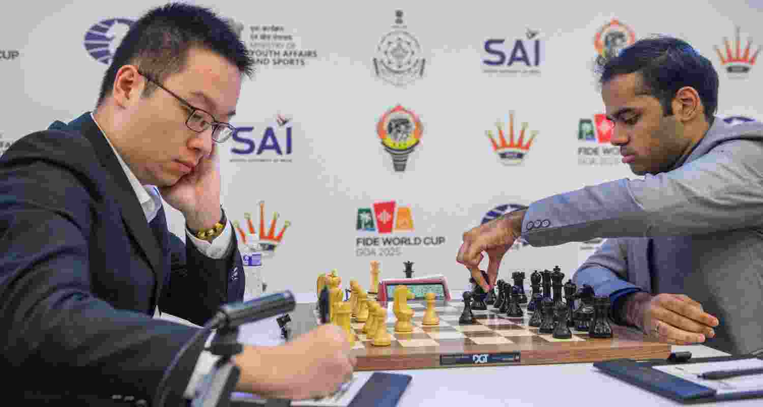Wei Yi of China and (right) Arjun Erigaisi in action during the quarterfinals of the FIDE World Cup in Panaji on Monday. Wei Yi of China and (right) Arjun Erigaisi in action during the quarterfinals of the FIDE World Cup in Panaji on Monday.