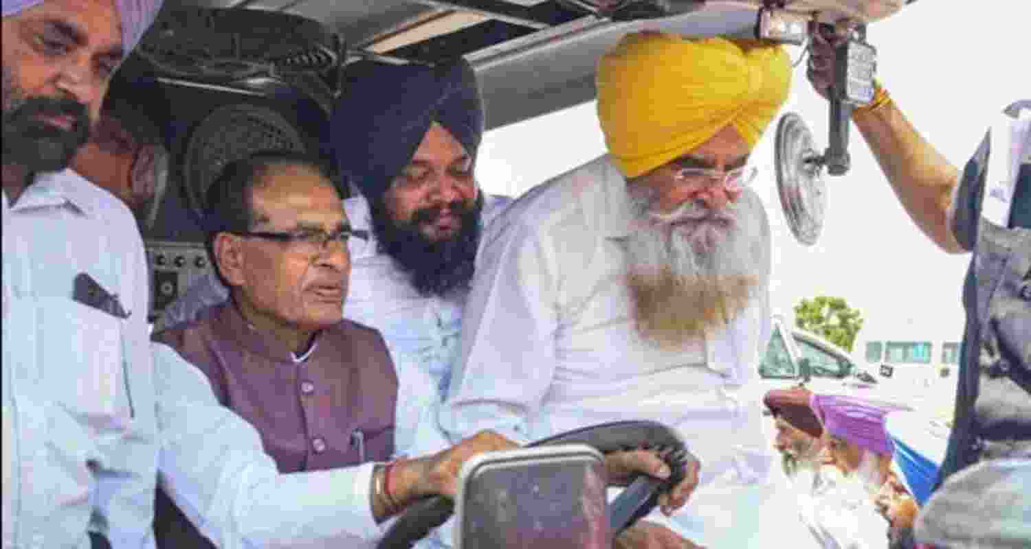 Union agriculture minister Shivraj Singh Chouhan drives a tractor as Punjab agriculture minister Gurmeet Singh Khudian (right) accompanies him to a Kisan Chaupal at Kheri Gandiyan village in Rajpu. Union agriculture minister Shivraj Singh Chouhan drives a tractor as Punjab agriculture minister Gurmeet Singh Khudian (right) accompanies him to a Kisan Chaupal at Kheri Gandiyan village in Rajpu.