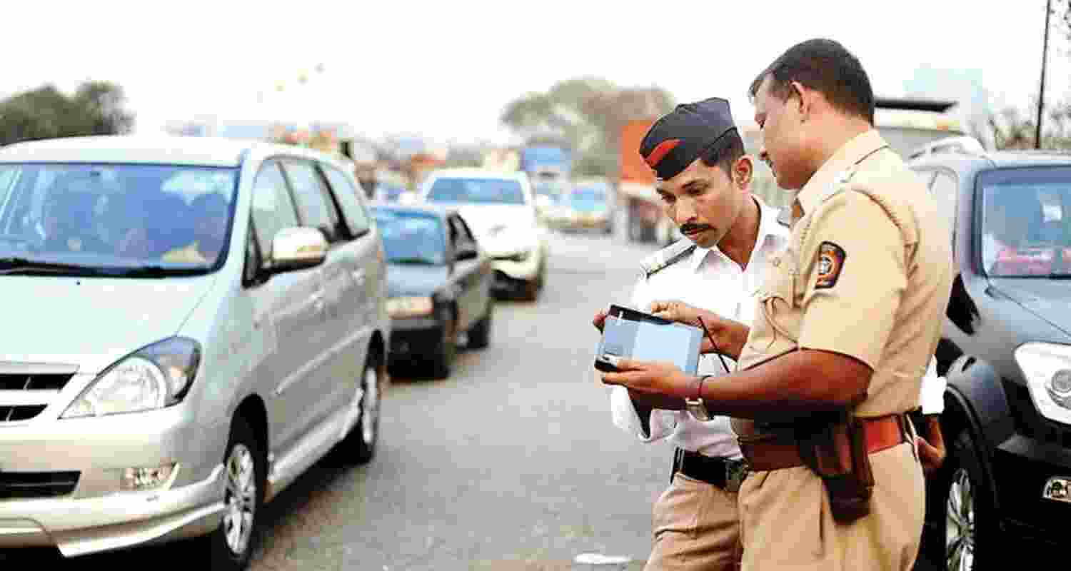 Car owner in UP fined for not wearing helmet Car owner in UP fined for not wearing helmet