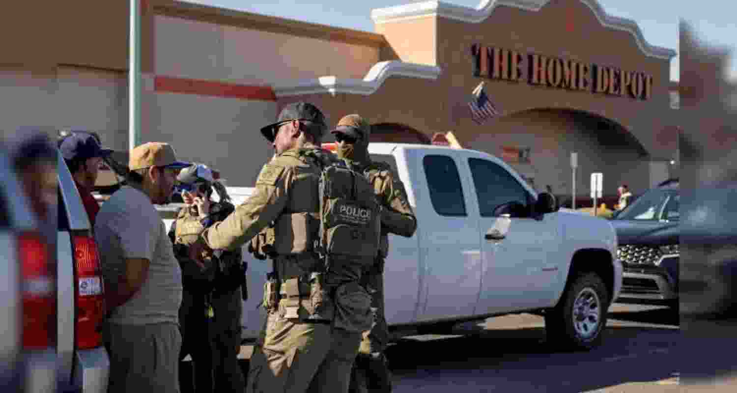 A representative image of ICE agents detain two documented immigrants with prior convictions. A representative image of ICE agents detain two documented immigrants with prior convictions.