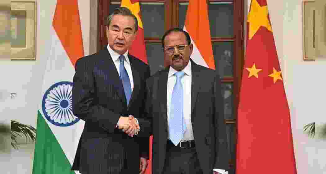 China’s Foreign Minister Wang Yi with India’s National Security Adviser (NSA) Ajit Doval. China’s Foreign Minister Wang Yi with India’s National Security Adviser (NSA) Ajit Doval.
