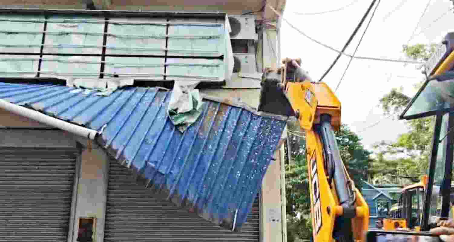 A JCB machine pressed into action to demolish TMC MP Abhishek Banerjee's office in Amtala, South 24 Parganas, on Saturday. A JCB machine pressed into action to demolish TMC MP Abhishek Banerjee's office in Amtala, South 24 Parganas, on Saturday.