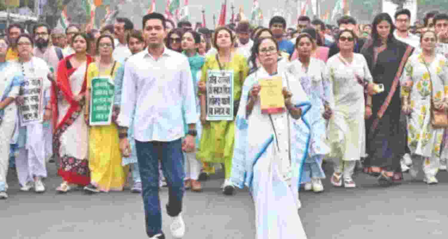 TMC leaders Mamata Banerjee and Abhishek Banerjee lead a protest march - file image. TMC leaders Mamata Banerjee and Abhishek Banerjee lead a protest march - file image.