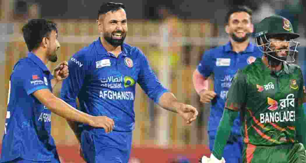 Afghanistan players celebrate a wicket against Bangladesh.  Afghanistan players celebrate a wicket against Bangladesh.