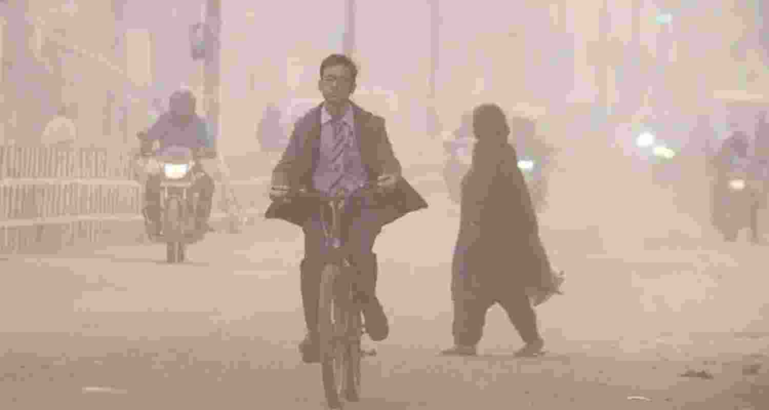 Commuters make their way amid low-visibility as air quality continues to deteriorate in Delhi-NCR, in Gurugram, Thursday. Commuters make their way amid low-visibility as air quality continues to deteriorate in Delhi-NCR, in Gurugram, Thursday.