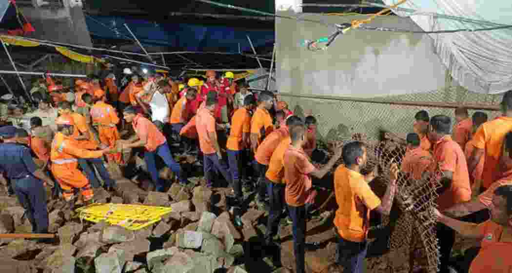 Rescue personnel at Simhachalam temple in Visakhapatnam after a wall collapsed amid Chandanotsavam festivities, killing eight and injuring four devotees awaiting Nijaroopa Darshan in the early hours of Wednesday. Rescue personnel at Simhachalam temple in Visakhapatnam after a wall collapsed amid Chandanotsavam festivities, killing eight and injuring four devotees awaiting Nijaroopa Darshan in the early hours of Wednesday.